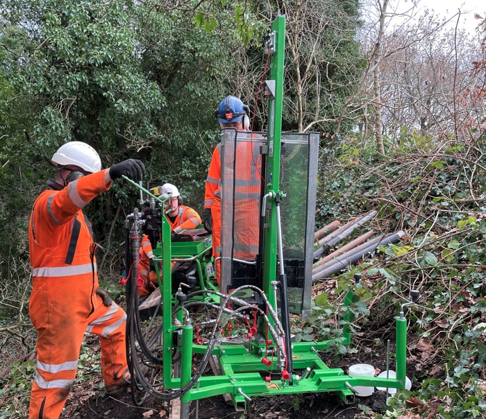 A compact ground investigation drilling rig working in dense vegetation