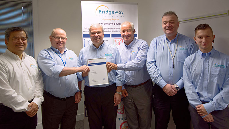 The Bridgeway Consulting team receiving a certificate of audit