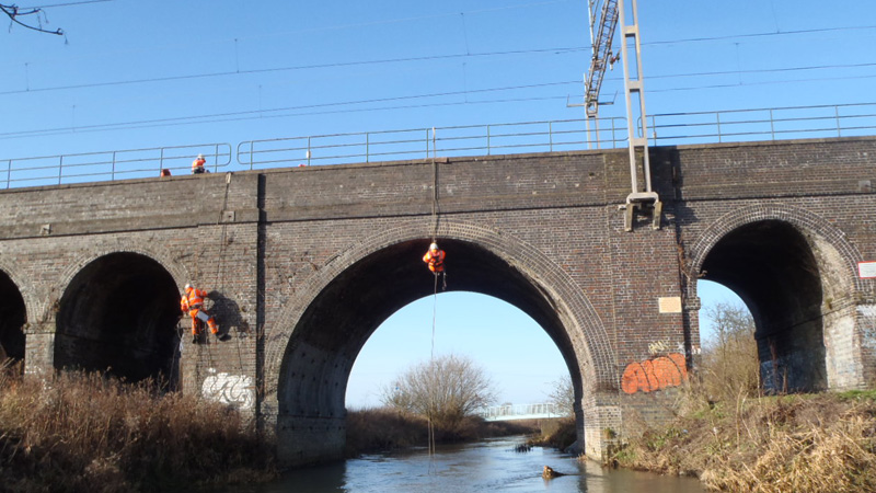 Bridgeway rope access engineers inspecting a brick railway bridge